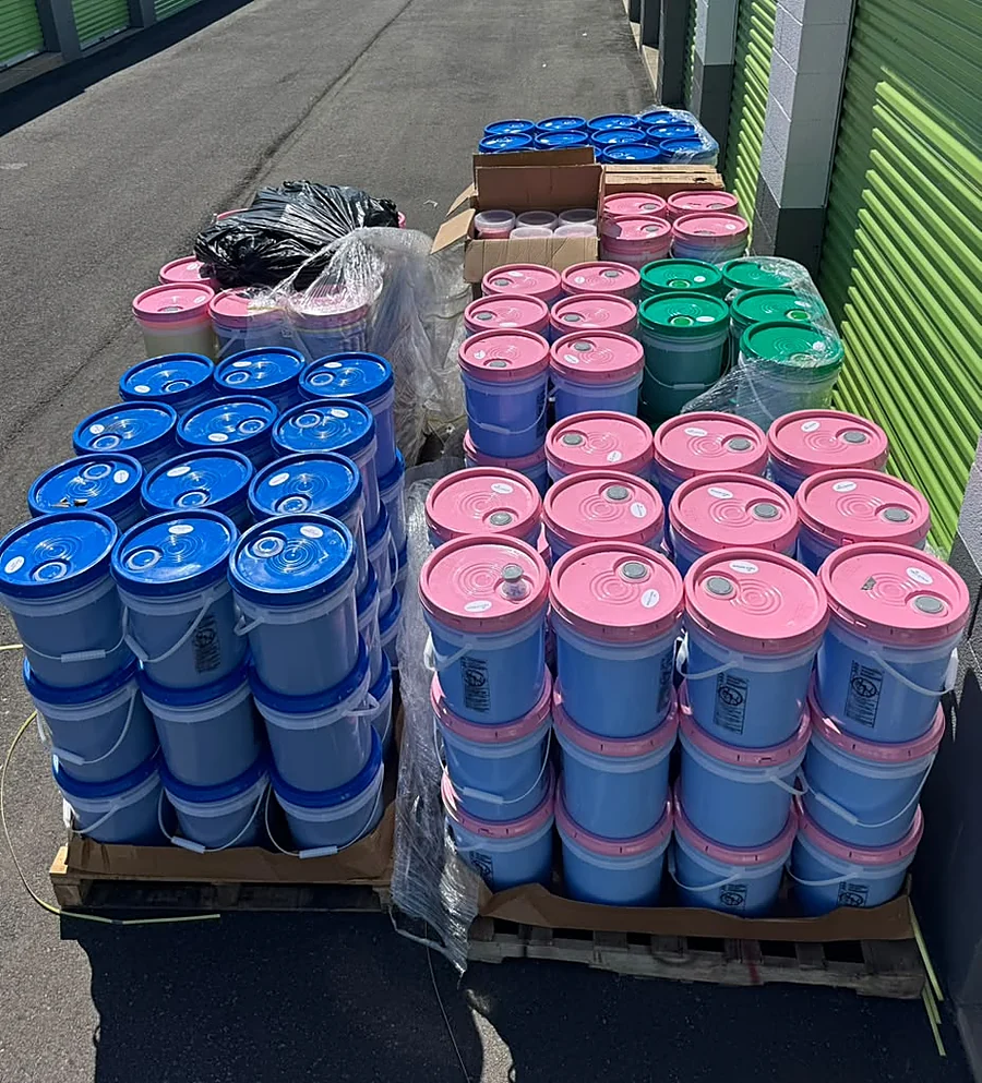 Pallets of buckets ready for pickup
